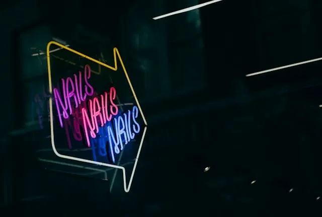 a neon sign that says nails nails nails for nail salon design