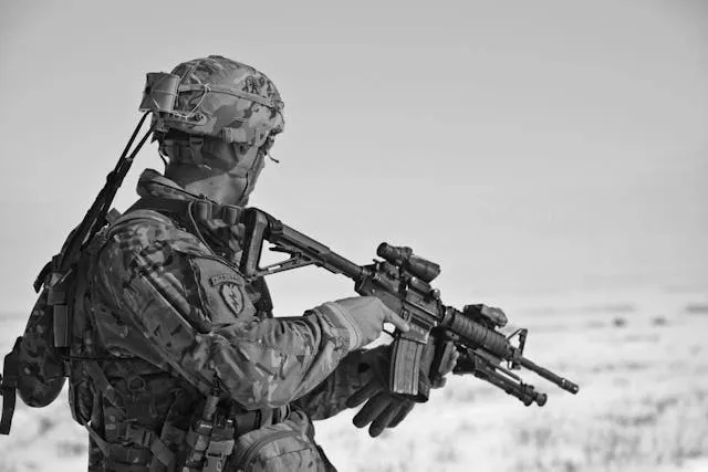 a grayscale photograph of a soldier wearing an airborne shoulder patch for coolest military patches