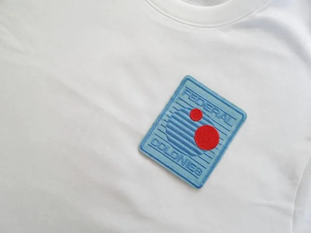 a blue rectangle patch on a white t-shirt for patch sizes