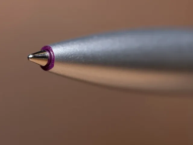 a close-up of the tip of a ballpoint pen for gel pen vs ballpoint