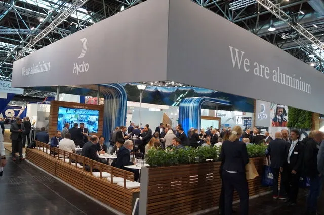 a gathering of people at a trade show booth for what is a trade show