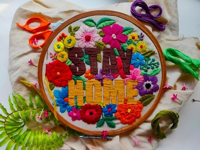 a colorful embroidered design with the words stay home for how to embroider letterss