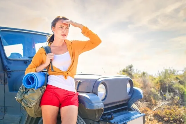 a woman walking on a hot sunny day for best neck fan