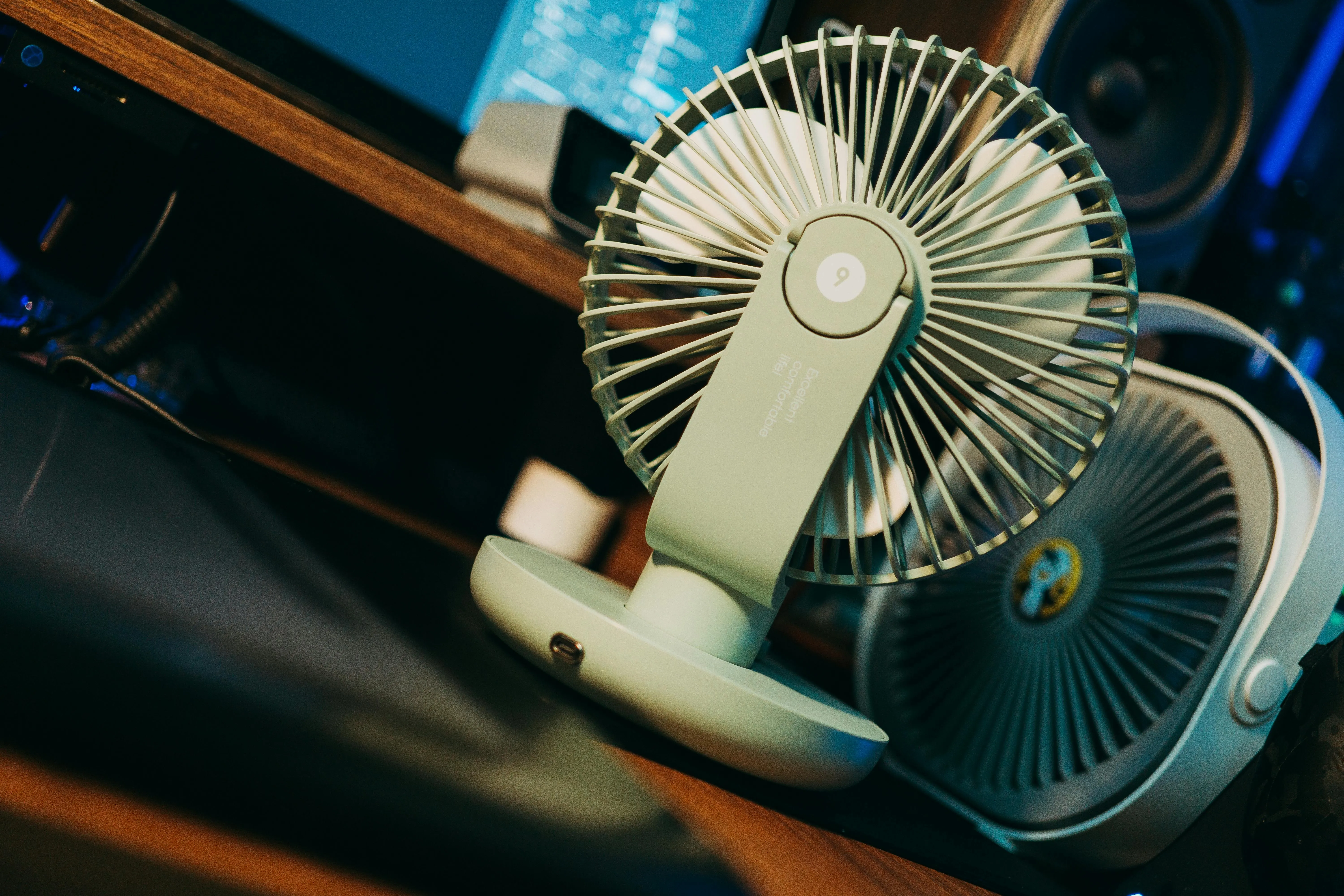 a personal fan on a desk for best portable fan