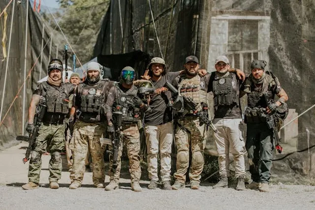 an airsoft team in full tactical gear for weird secret military patches