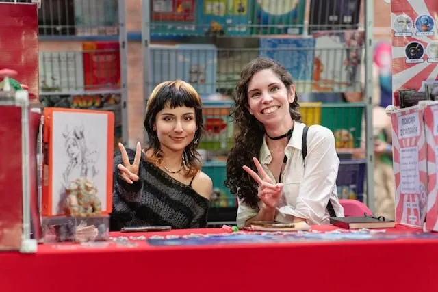 two women at a trade show booth for trade show planning two women at a trade show booth for trade show planning