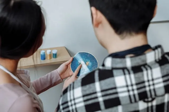 two people looking at a resin coaster for geode resin coasters two people looking at a resin coaster for geode resin coasters
