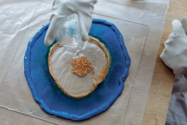 a person pouring resin for geode resin coasters a person pouring resin for geode resin coasters