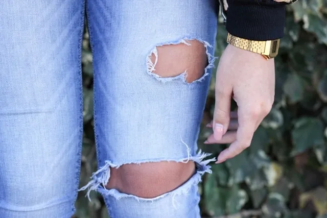 a pair of jeans with holes for how to use iron-on patches for holes a pair of jeans with holes for how to use iron-on patches for holes