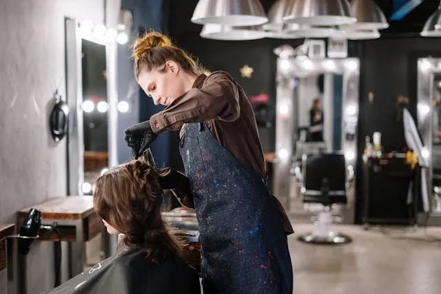 a woman getting a haircut for salon lighting ideas a woman getting a haircut for salon lighting ideas