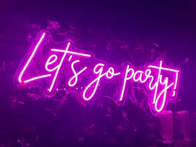 a pink neon sign that says let's go party for bar lighting ideas a pink neon sign that says let's go party for bar lighting ideas