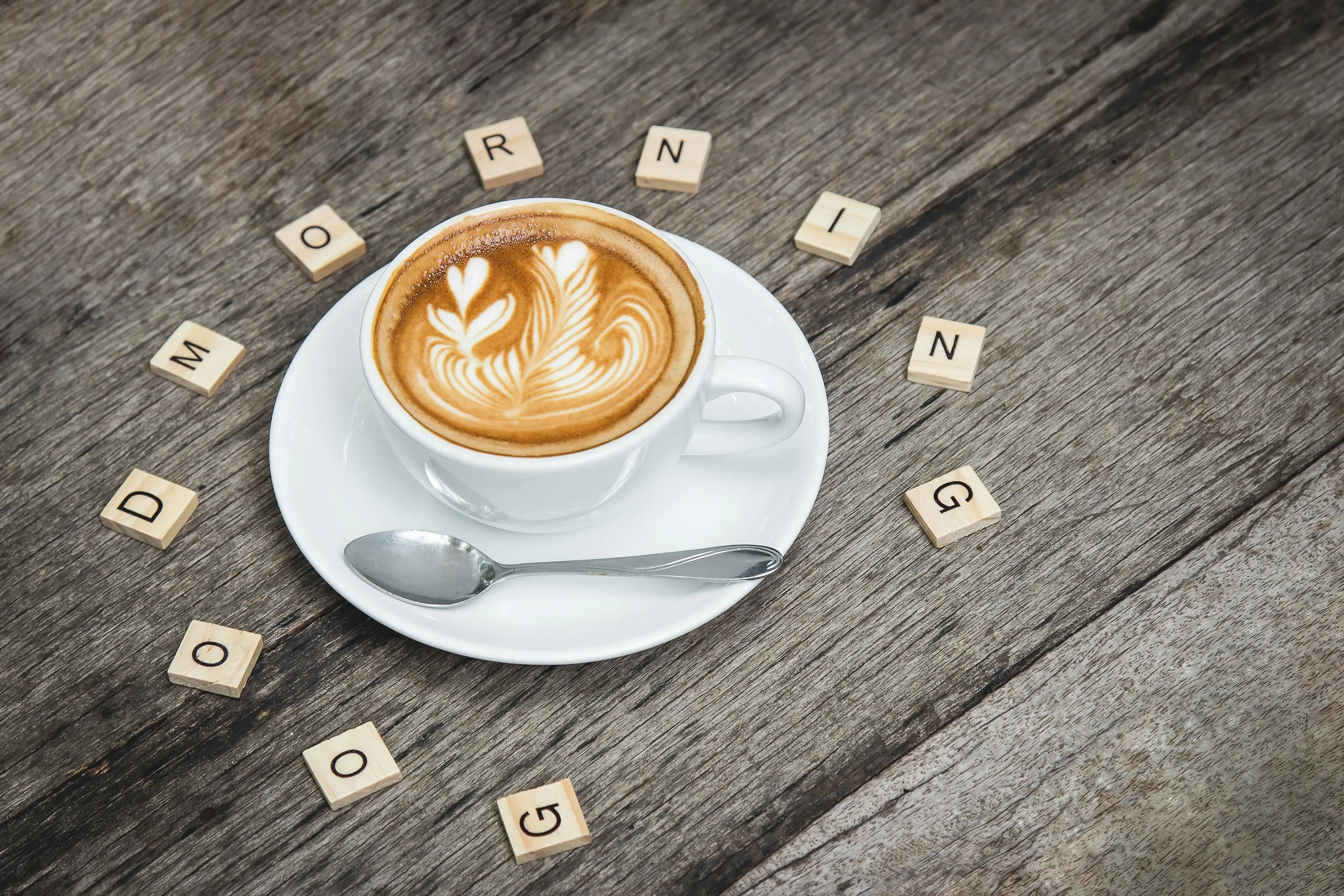 a cup of coffee surrounded by scrabble tiles for scrabble coasters a cup of coffee surrounded by scrabble tiles for scrabble coasters