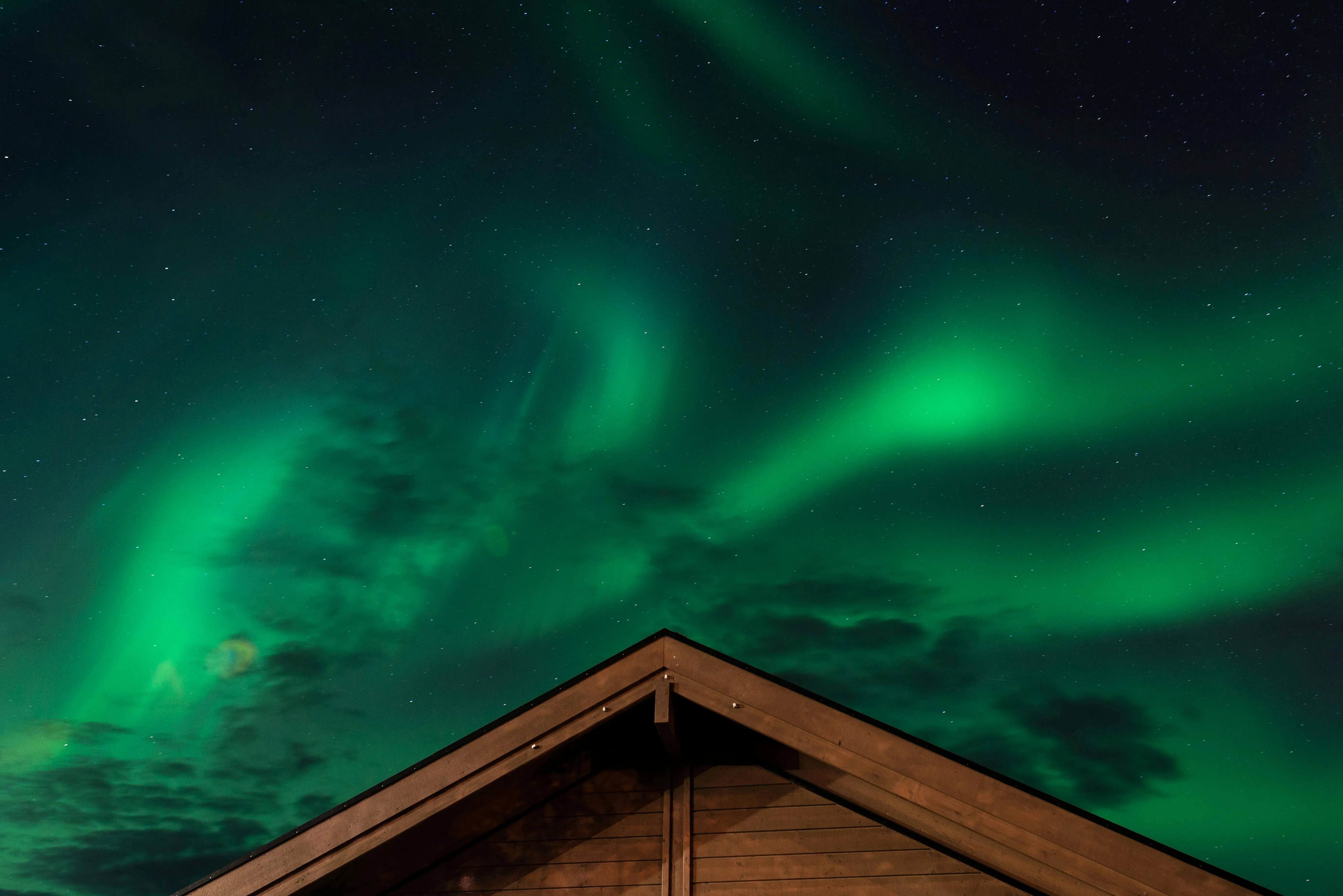 a brown house under the aurora borealis for are neon lights plasma a brown house under the aurora borealis for are neon lights plasma