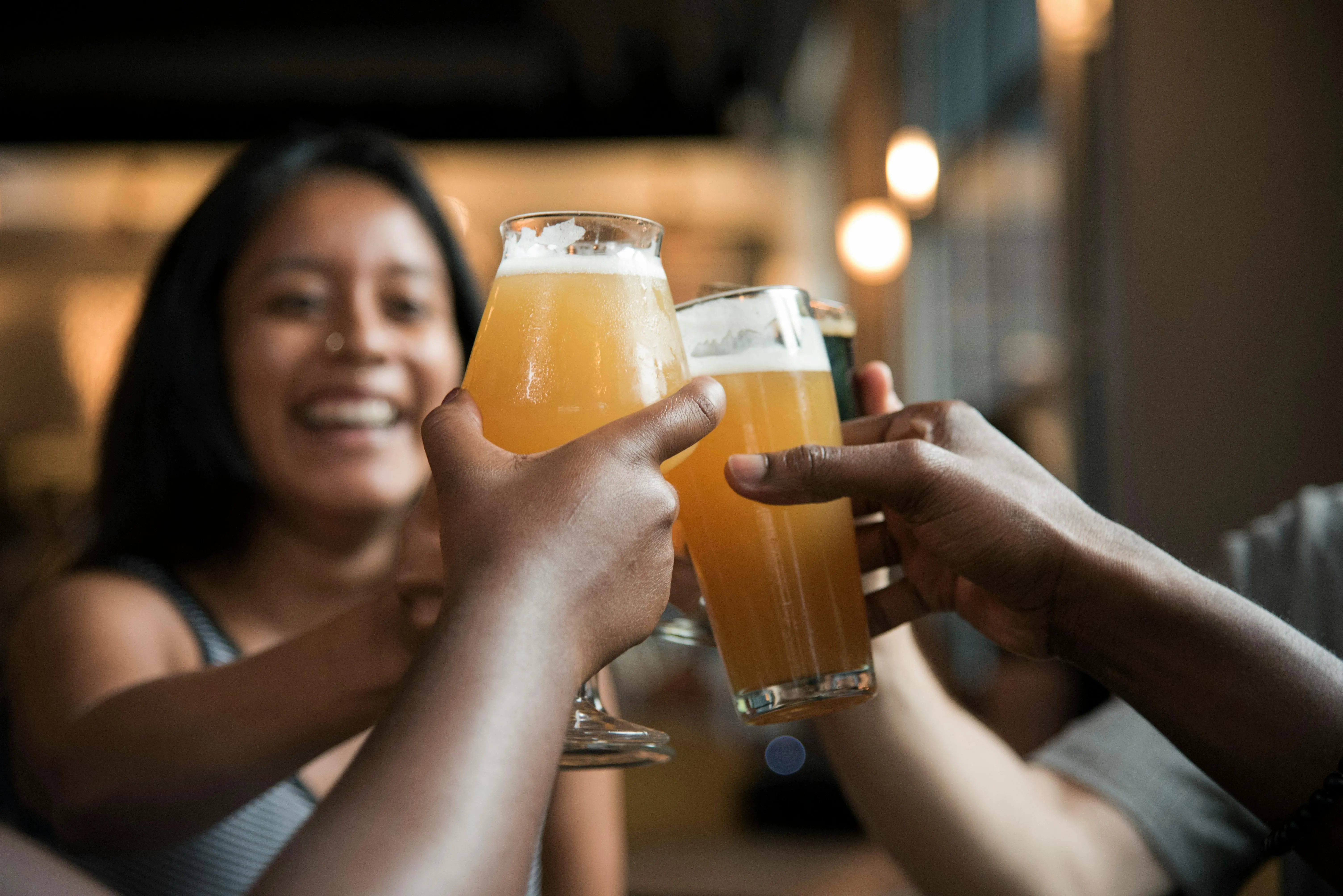 people toasting with glasses inside a building for why are coasters called coasters people toasting with glasses inside a building for why are coasters called coasters