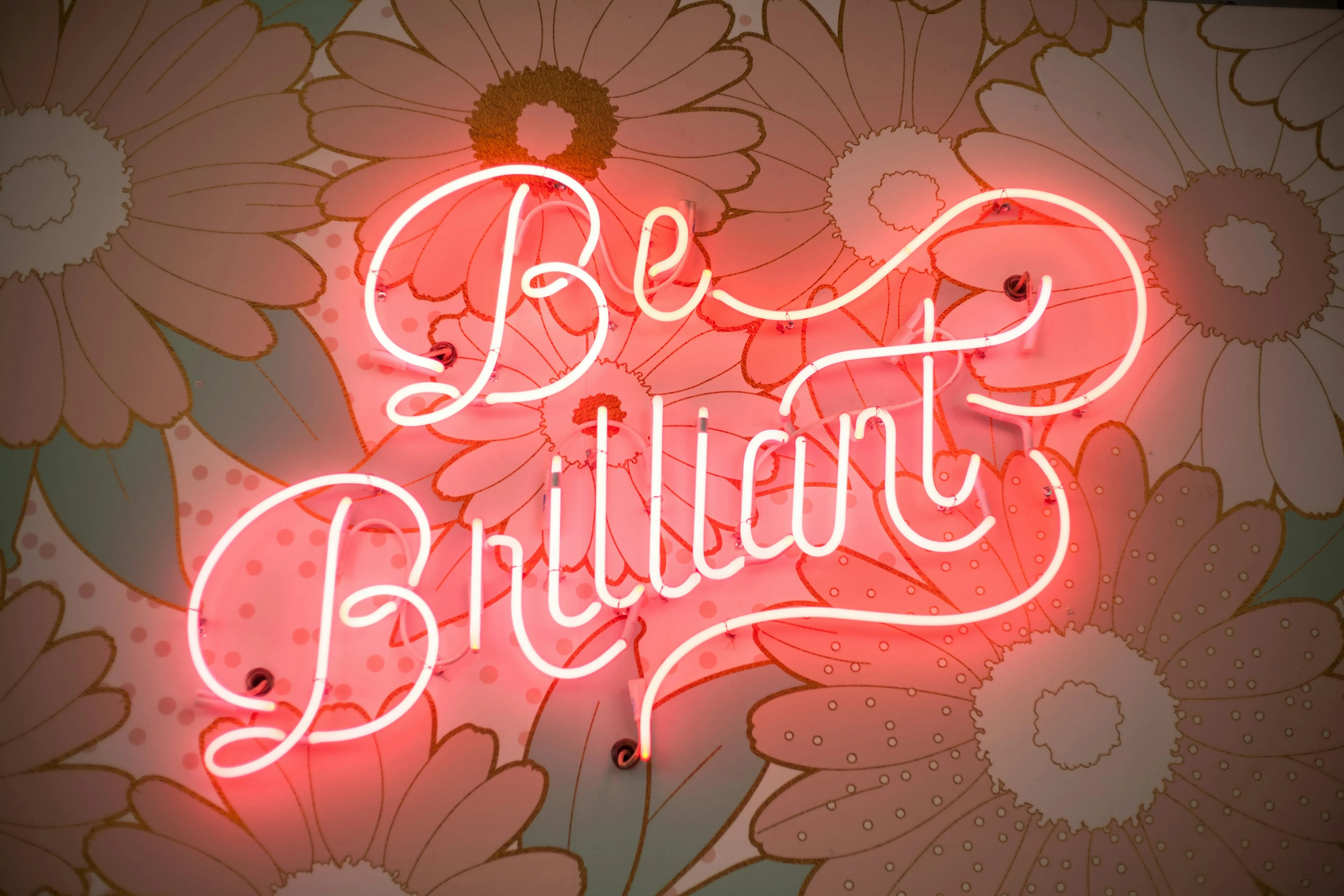 a red neon sign that reads be brilliant for gas in neon lights a red neon sign that reads be brilliant for gas in neon lights