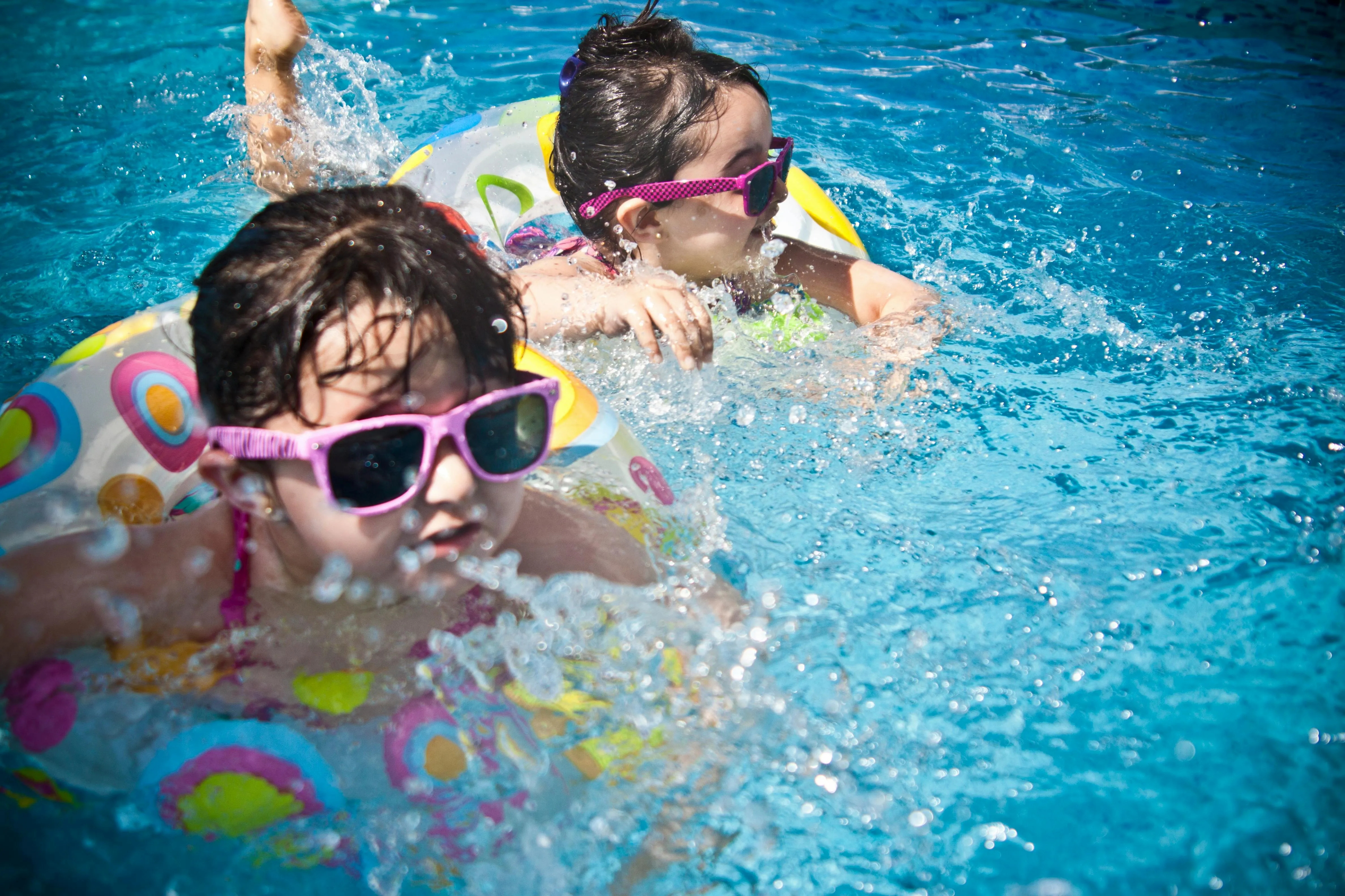 two children splashing in the pool for pool party decorations two children splashing in the pool for pool party decorations