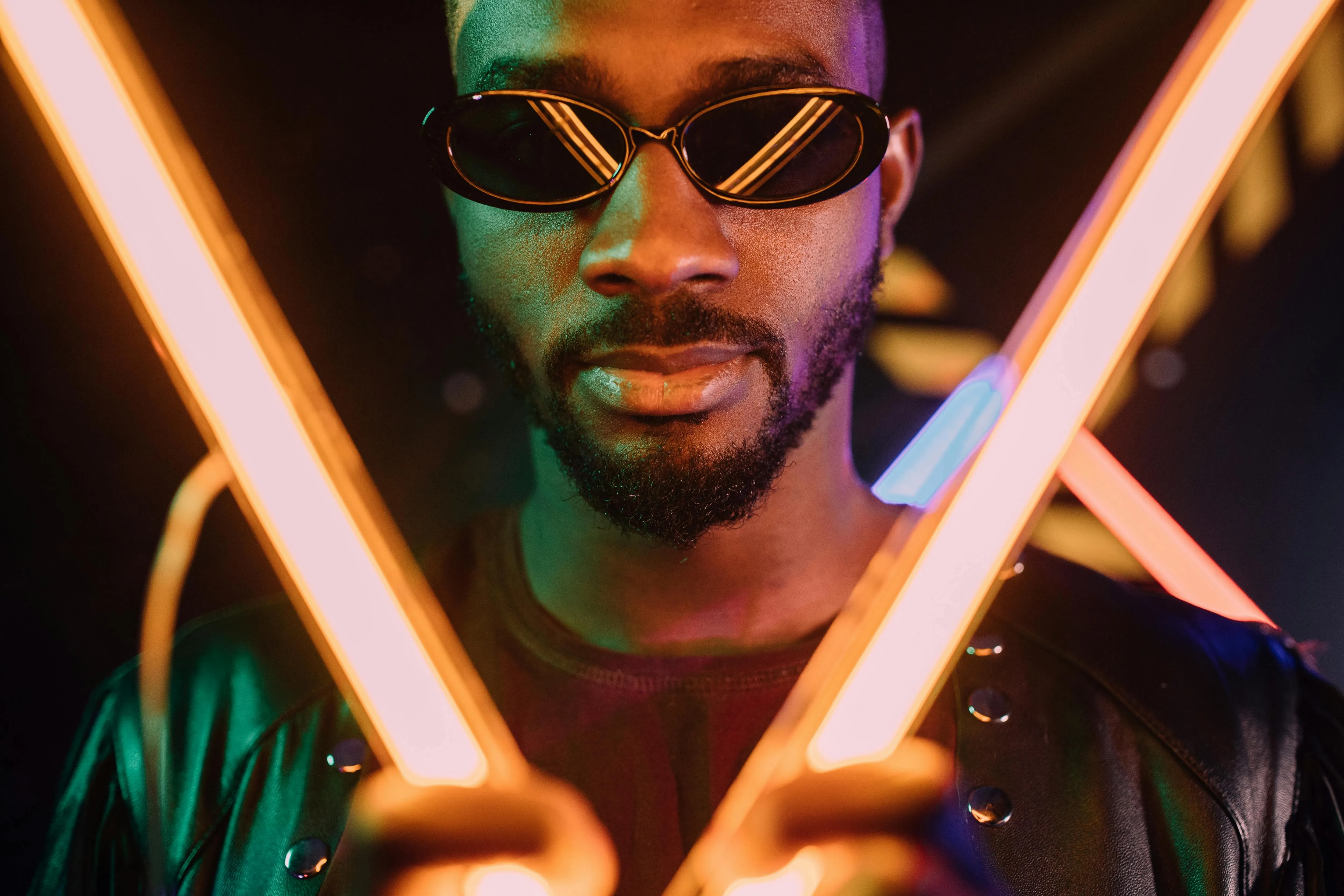 a man wearing sunglasses for neon light portraits a man wearing sunglasses for neon light portraits