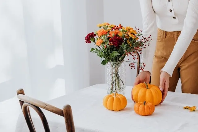 someone arranging pumpkins on a table for table runner alternatives someone arranging pumpkins on a table for table runner alternatives
