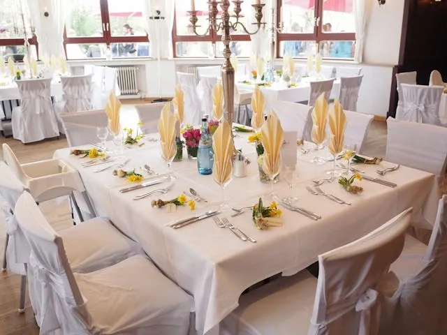 an elegantly decorated dining table for wedding napkin folds