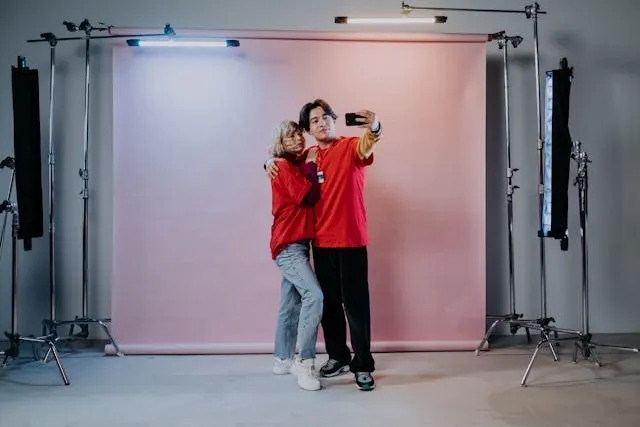a man and woman taking a selfie for backdrop ideas a man and woman taking a selfie for backdrop ideas