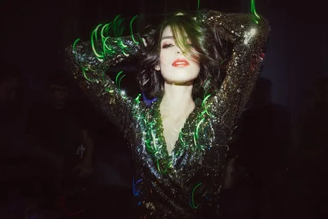 a woman dancing for glow in the dark party ideas