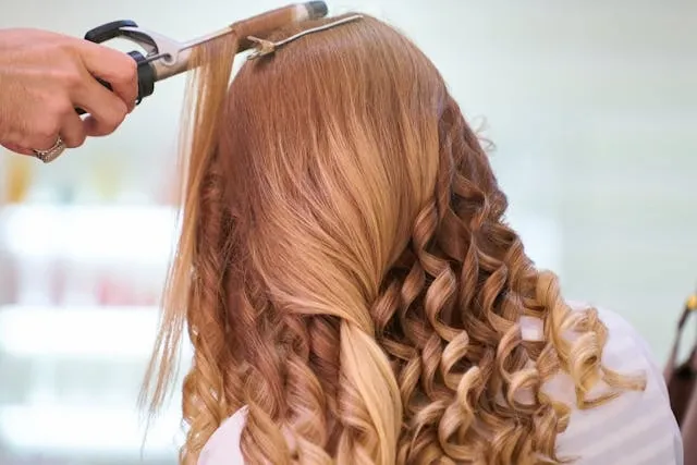 a photo of hair being styled for hair salon signs ideas a photo of hair being styled for hair salon signs ideas