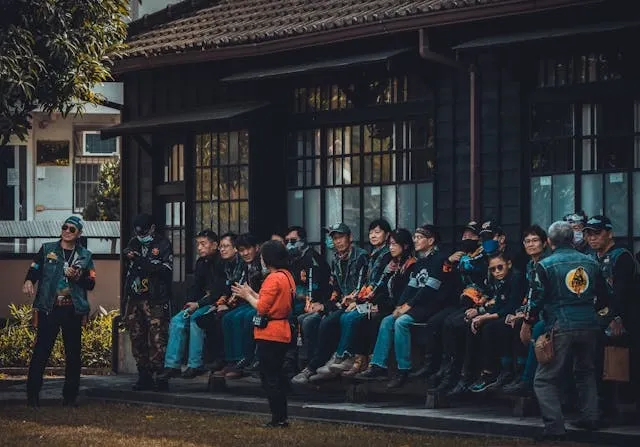 members of a motorcycle club sitting on a bench for motorcycle vest patches rules members of a motorcycle club sitting on a bench for motorcycle vest patches rules