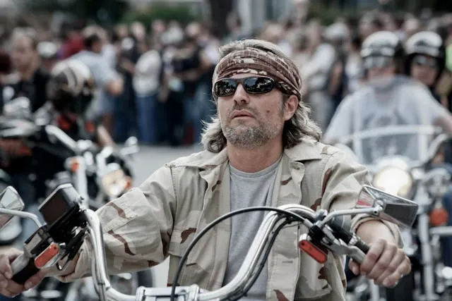 a man sitting on a motorcycle for motorcycle vest patches rules a man sitting on a motorcycle for motorcycle vest patches rules
