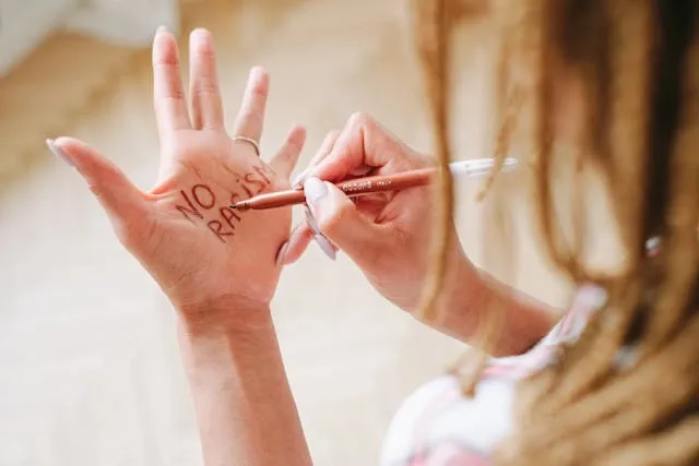 a person writing on their hand for can you get ink poisoning from a pen a person writing on their hand for can you get ink poisoning from a pen