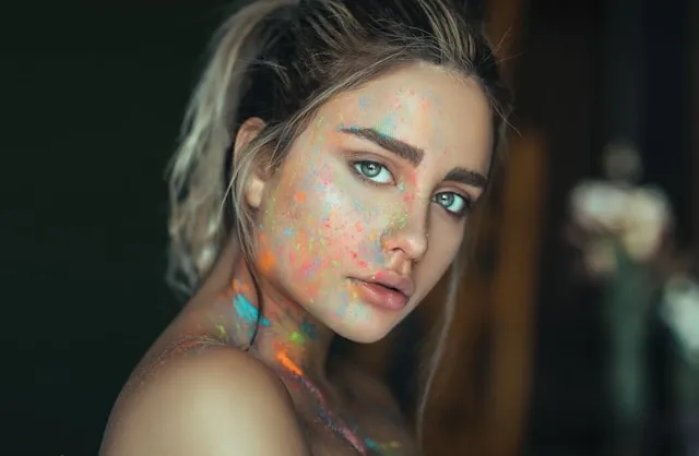 a woman with colorful ink on her face for how to get pen ink off skin a woman with colorful ink on her face for how to get pen ink off skin