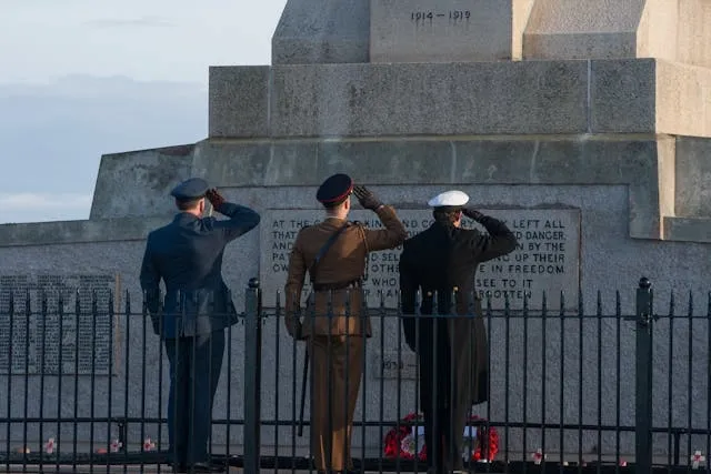 soldiers salute a war monument for world war 2 wwii army patches identification soldiers salute a war monument for world war 2 wwii army patches identification