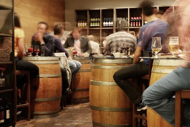 people sitting in a bar for how much does it cost to open a bar