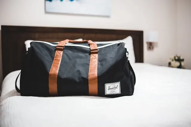 a bag on a bed for how to wash a duffel bag a bag on a bed for how to wash a duffel bag
