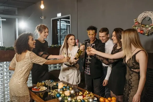 friends raising a toast around a table for dining table decor ideas