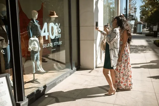 a store window with decals for boutique sign ideas