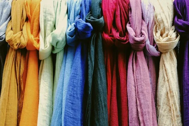 a series of knotted linen scarves for how to store scarves