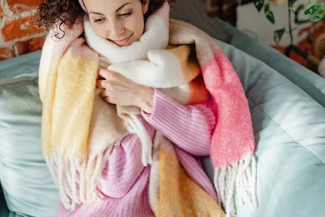 a person wrapped up in a pastel scarf for free reversible scarf knitting patterns