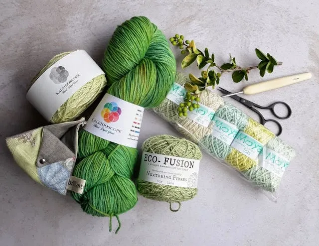 green yarn and crochet tools for crochet stitches for scarves