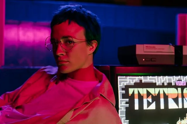 a person wearing a hoodie and glasses for 80s theme birthday party