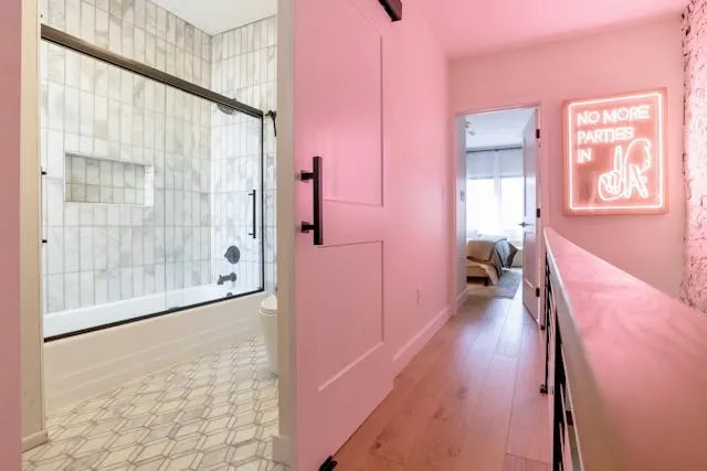 a pink neon light in a hallway for aesthetic room decor ideas
