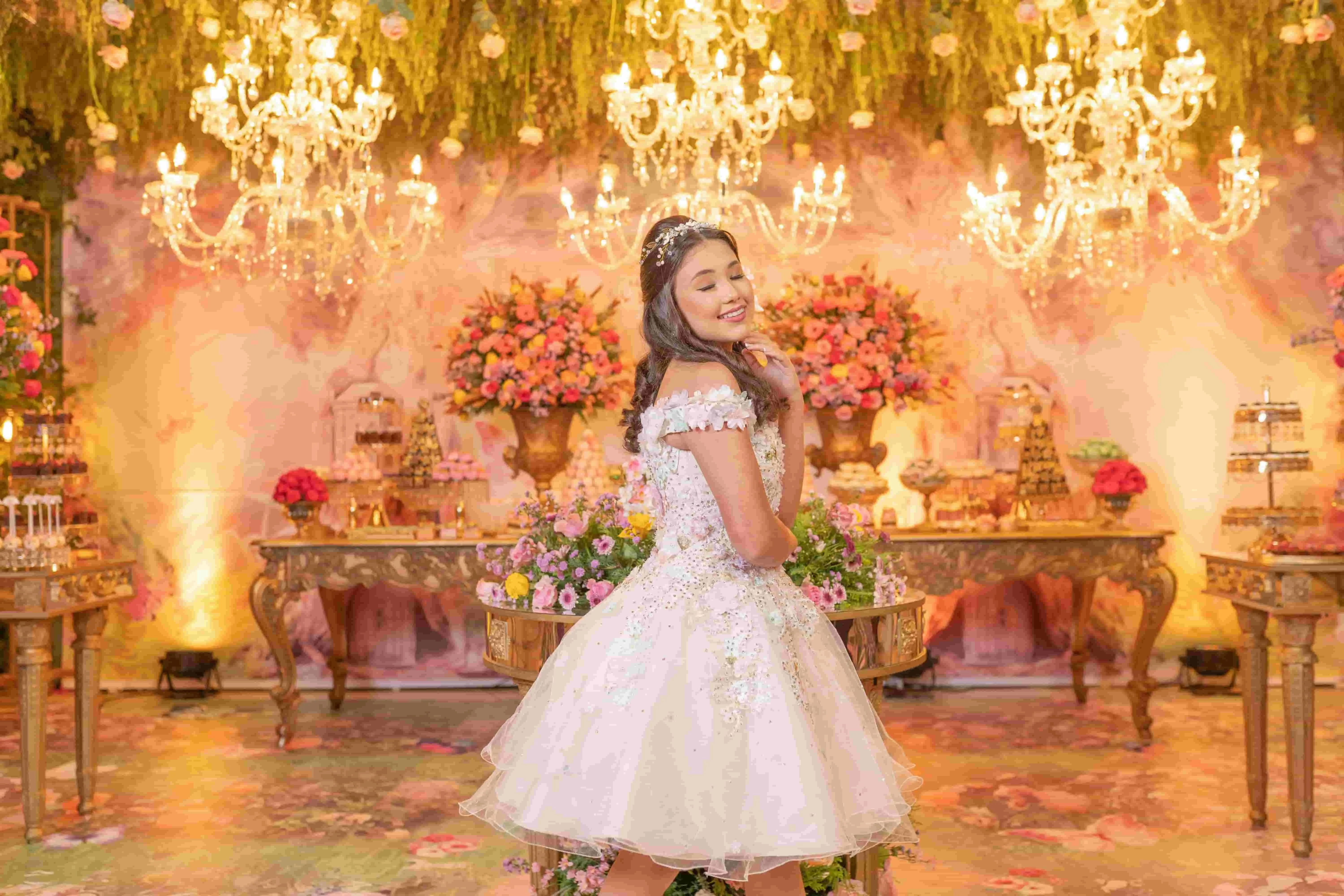 a smiling teenager in front of an elegant backdrop for quinceanera backdrop ideas