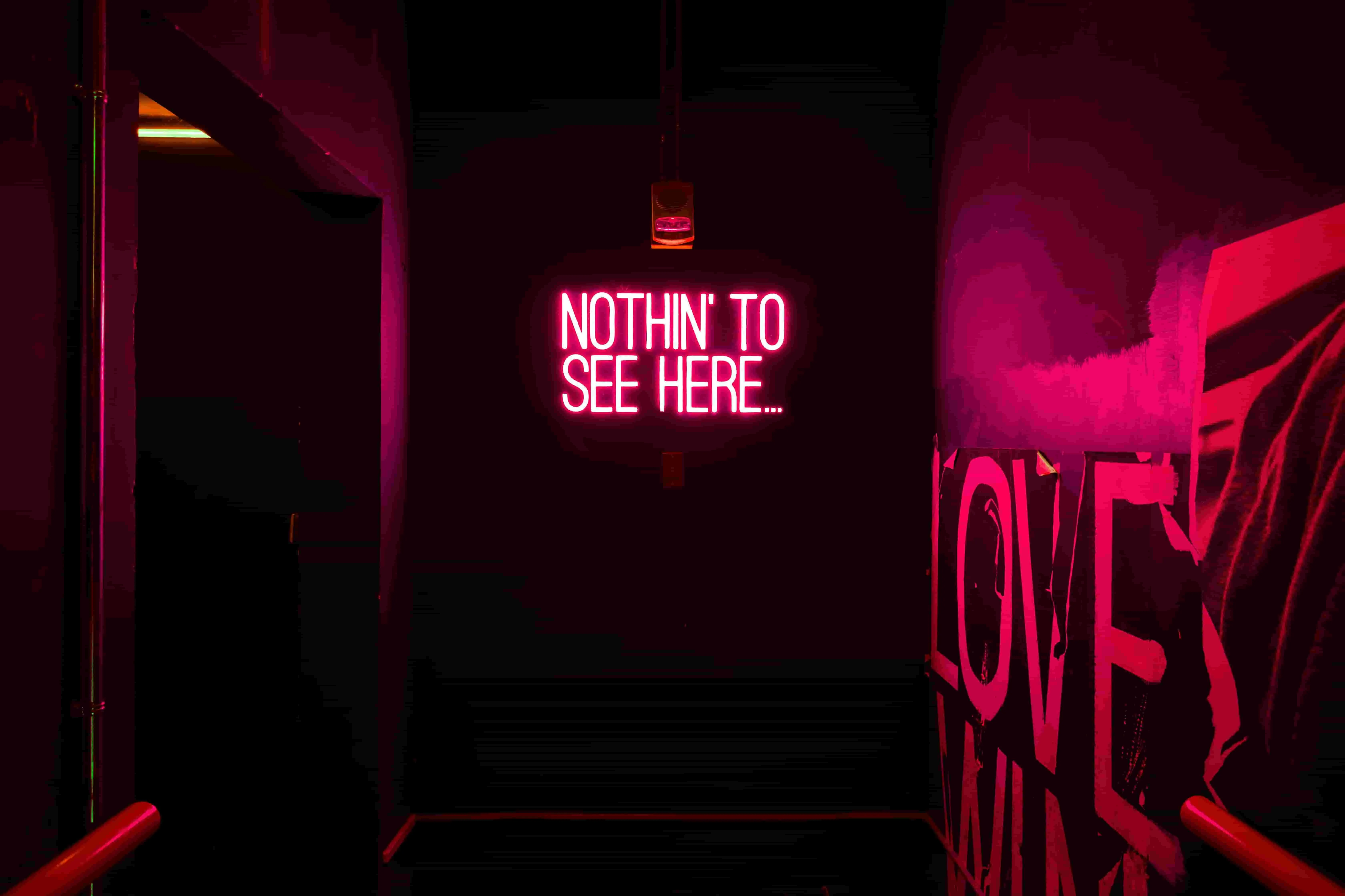 a neon sign that reads nothin to see here in a pink hue for funny neon sign quotes