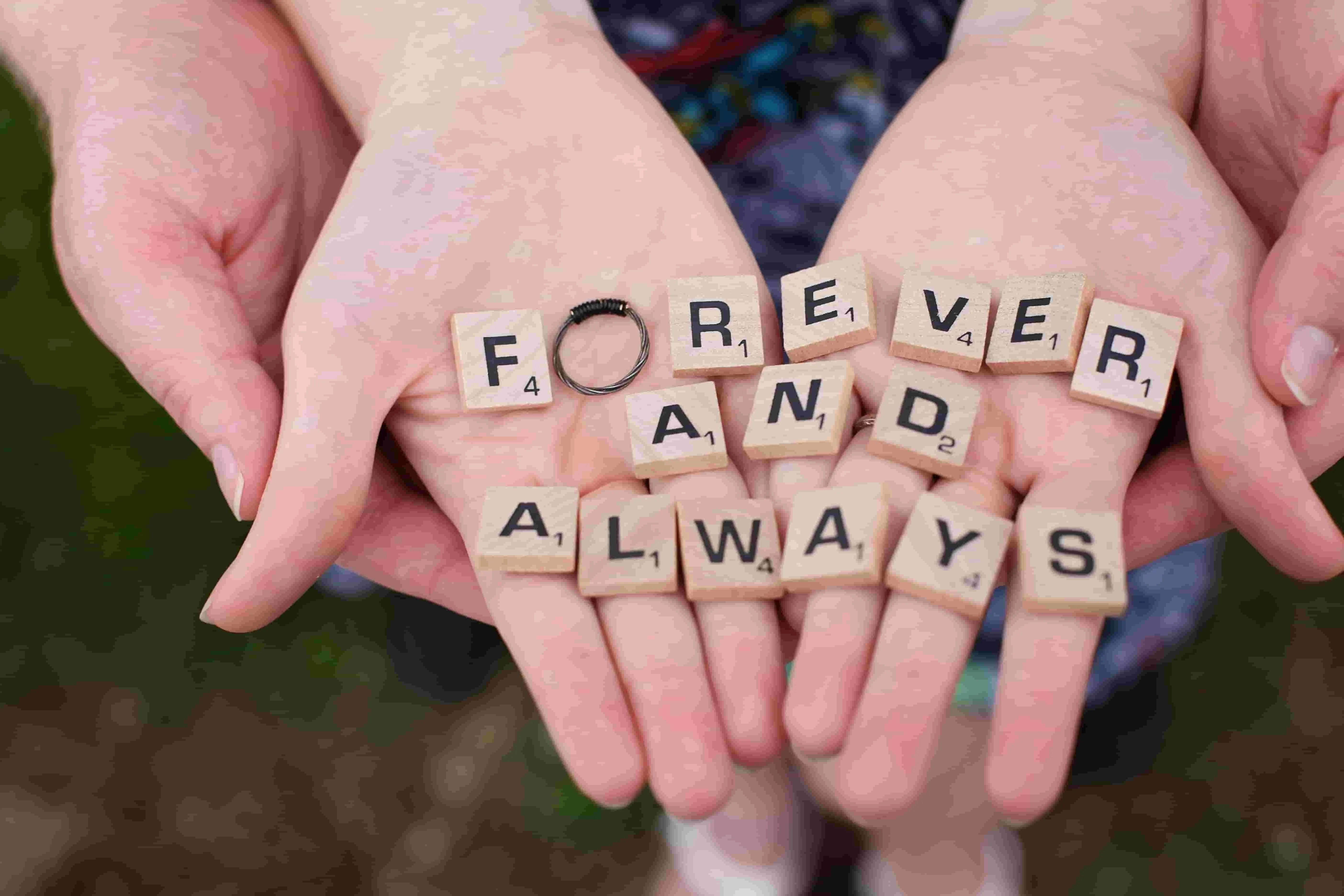 scrabble tiles on a person’s hands for engagement party ideas