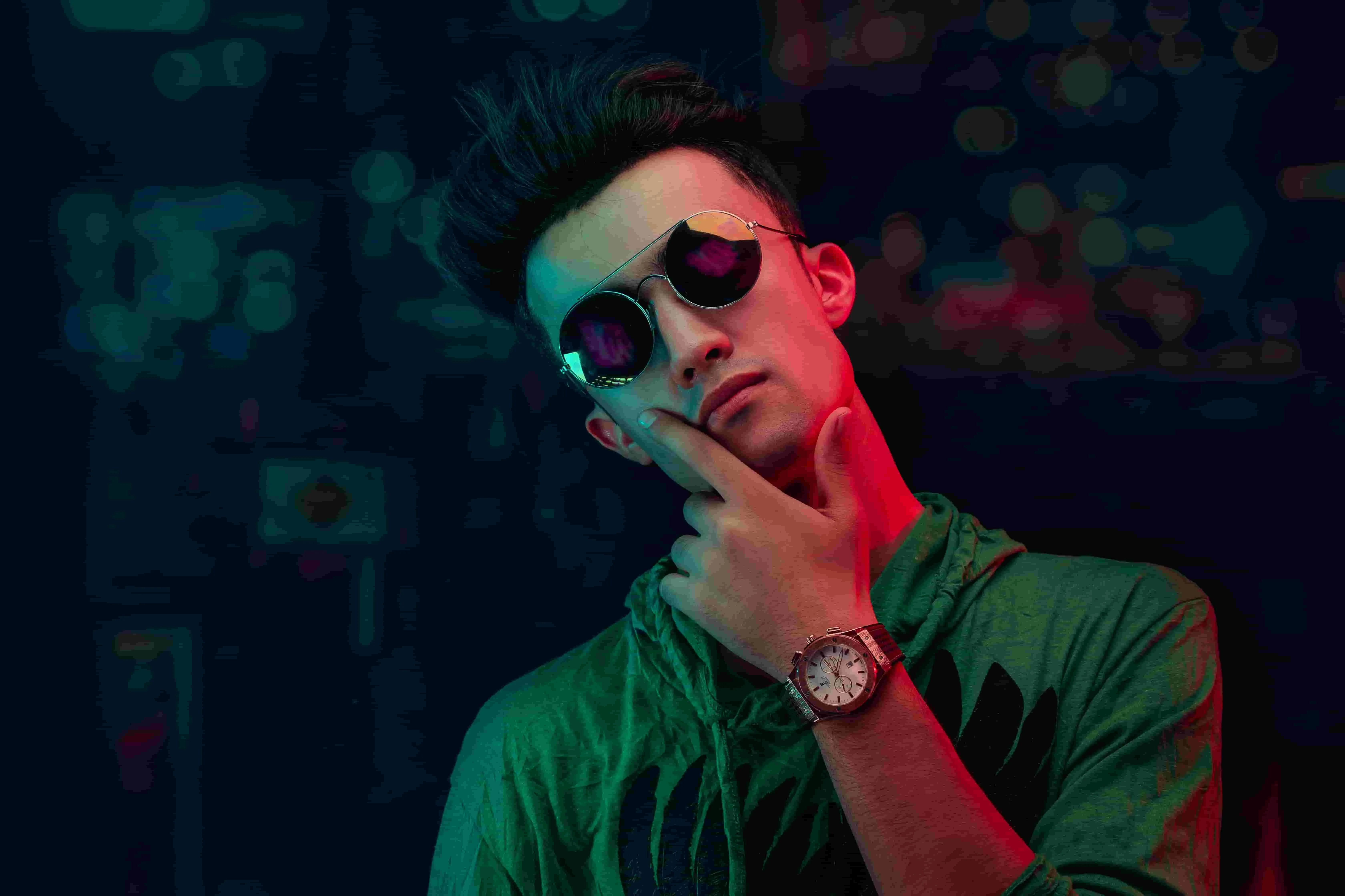 a stylish man illuminated by neon lights for neon lights captions