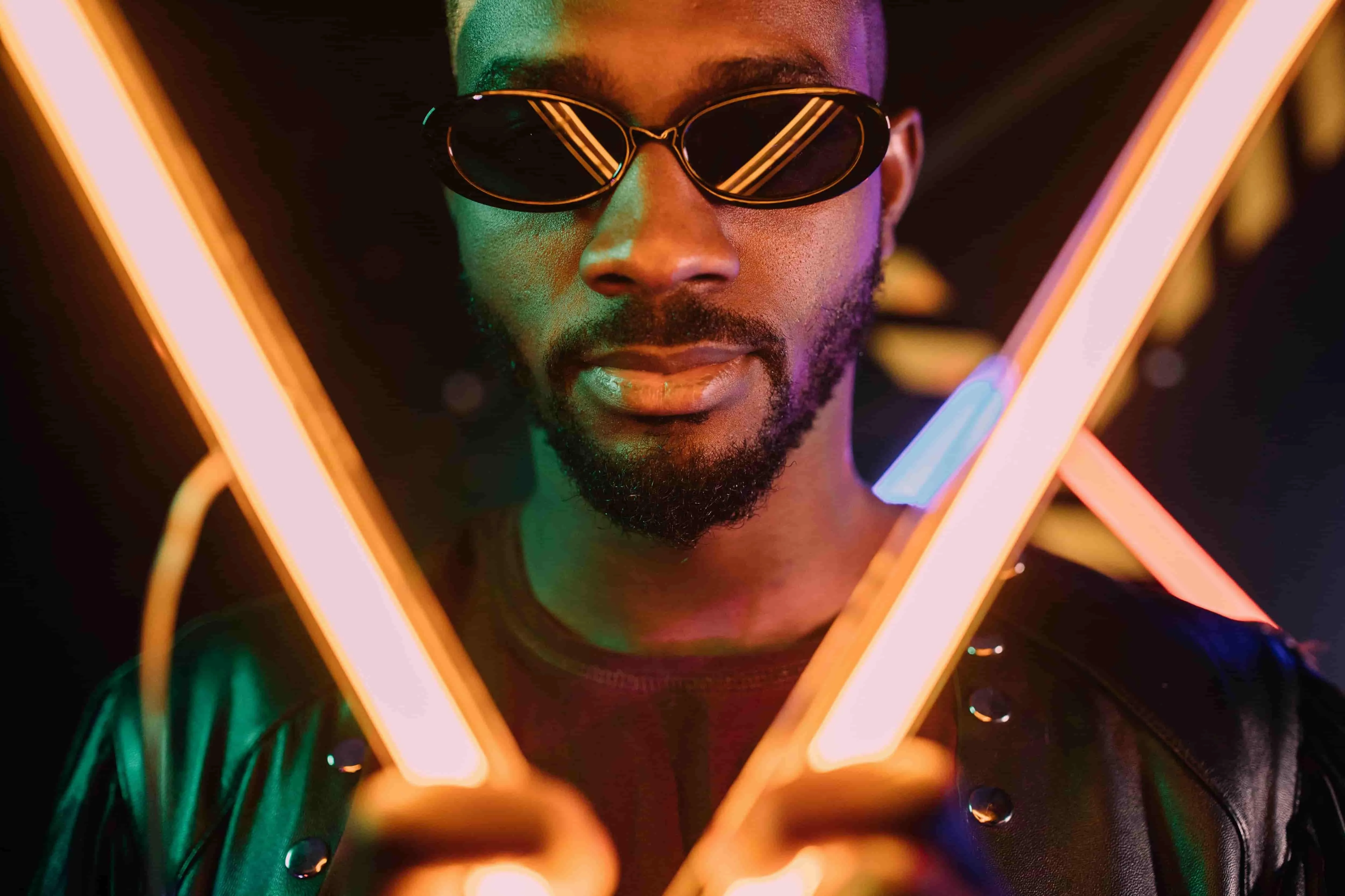 a man wearing sunglasses for neon light portraits