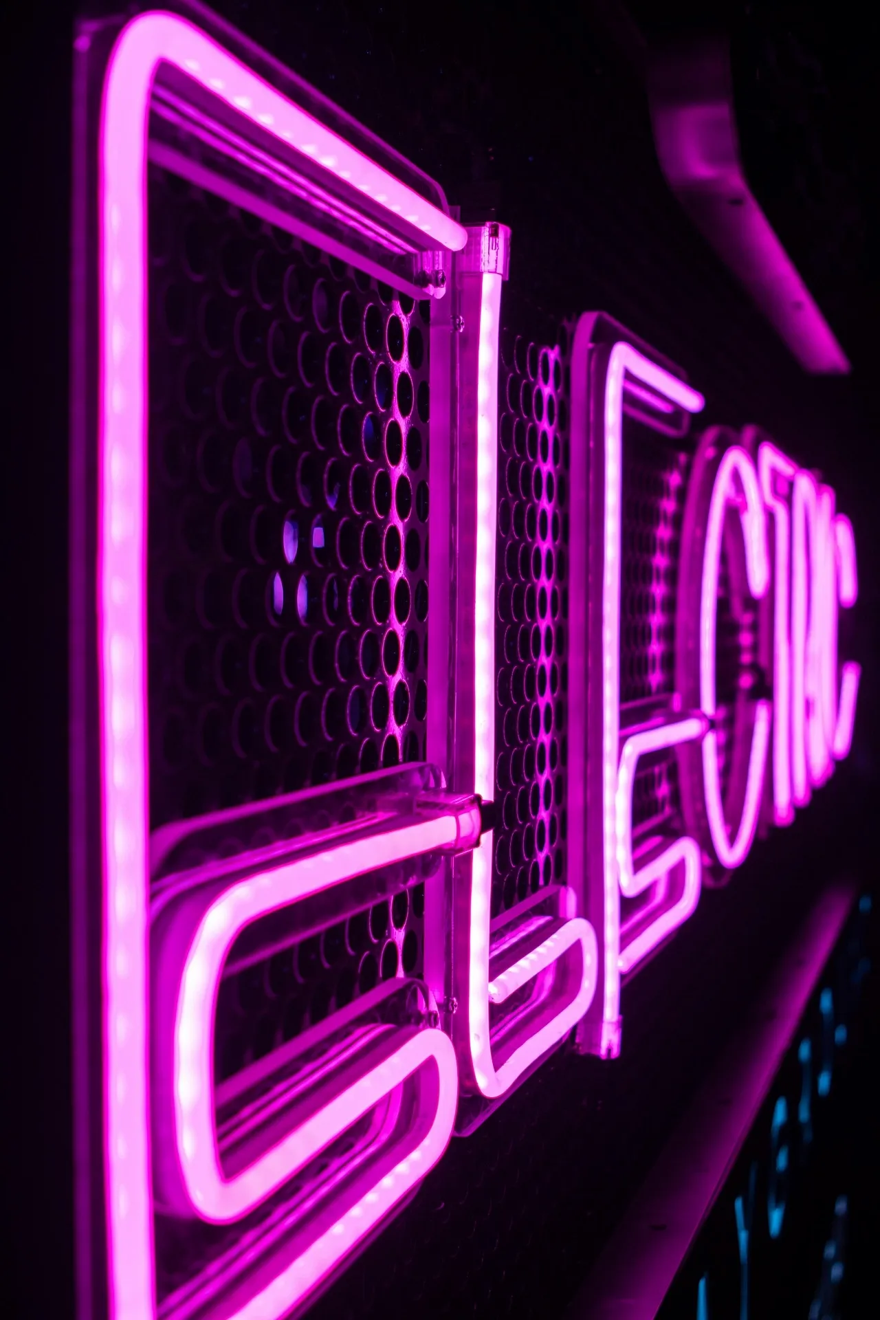 violet neon light glowing in a dark room for neon dark purple aesthetic
