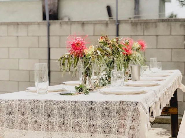 Elegant outdoor table with tablecloth for table throw vs tablecloth