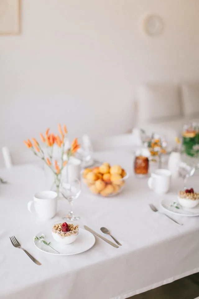 Beautiful white table setting with tablecloth for tablecloth sizes