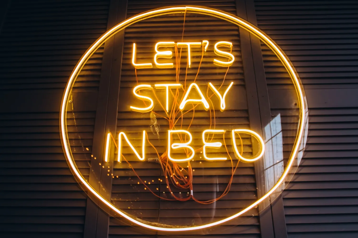 Neon inscription in the bedroom on the wall