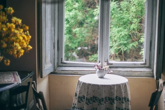 small round table by a window for round tablecloth sizes